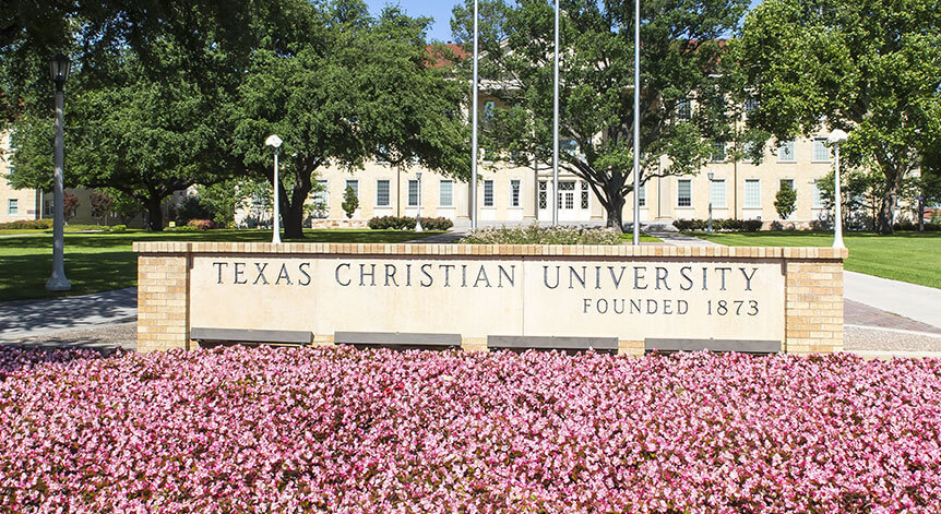 TCU sign with flowers in front